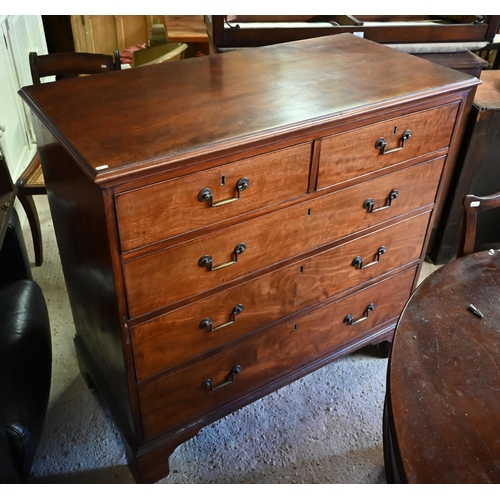 402 - A 19th century mahogany chest of two short over three long drawers with brass fittings on shaped bra... 