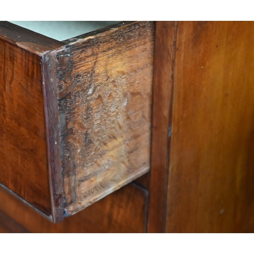 402 - A 19th century mahogany chest of two short over three long drawers with brass fittings on shaped bra... 