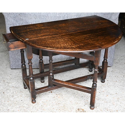 410 - An antique oak gateleg table