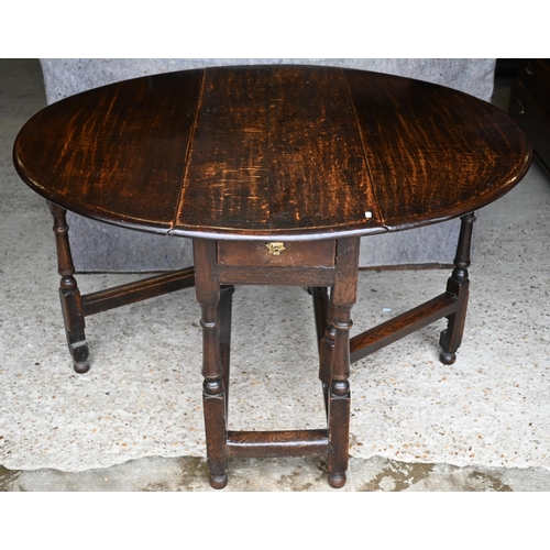 410 - An antique oak gateleg table