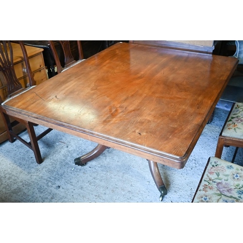 412 - A Victorian mahogany breakfast table, the rectangular tilt top raised on a turned support to four le... 