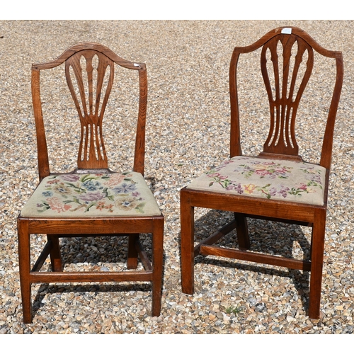 413 - #A set of four 19th century elm dining chairs with pierced vertical splats and floral tapestry pad s... 