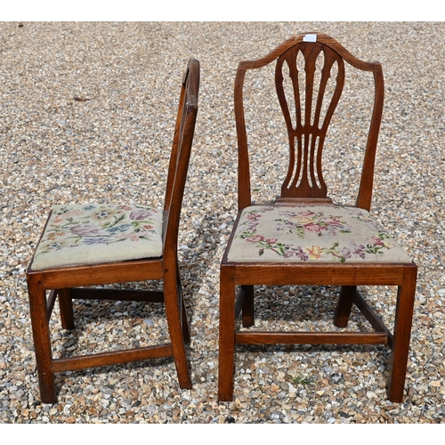 413 - #A set of four 19th century elm dining chairs with pierced vertical splats and floral tapestry pad s... 