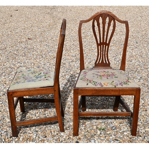 413 - #A set of four 19th century elm dining chairs with pierced vertical splats and floral tapestry pad s... 