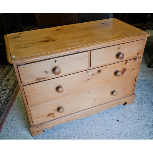 415 - An old stripped pine chest of two short over three long drawers on shaped bracket feet, to/w a dress... 