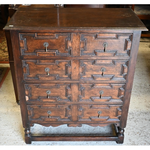 417 - An antique oak chest of four long drawers with applied geometric moulding in the Jacobean style, rai... 