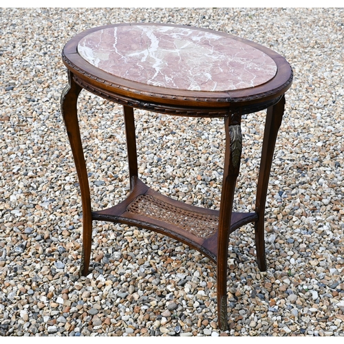 431 - #An old continental oval centre table with inset marble top over a cane panelled under-tier, 68 x 50... 