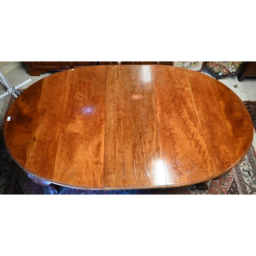 432 - A late Victorian mahogany wind out dining table, the extending oval top with two central leaves rais... 