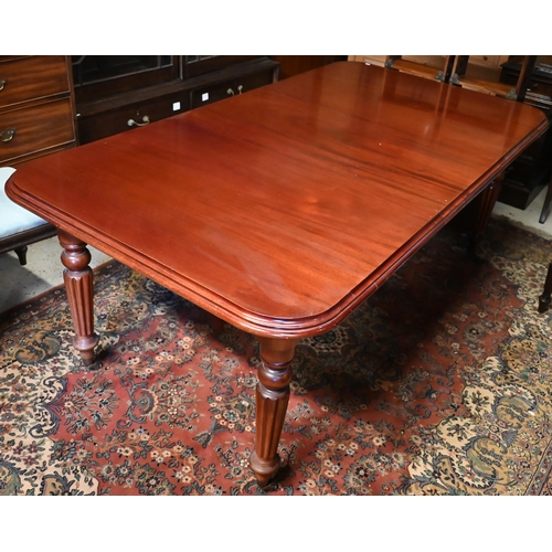 436 - A mahogany extending dining table in the Victorian style, raised on turned reeded legs to casters, c... 