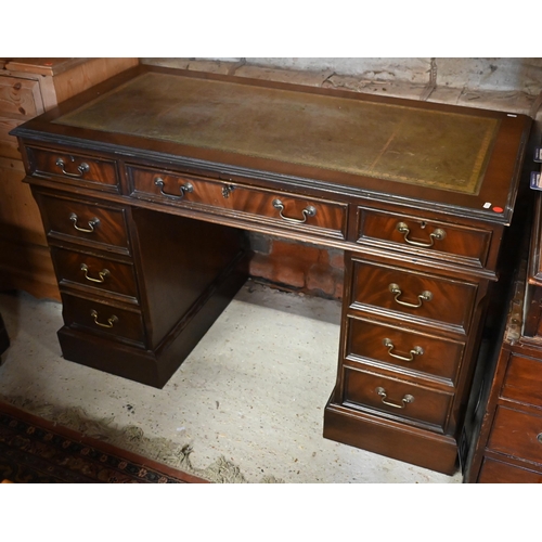 440 - A Victorian style mahogany twin pedestal desk with green leather top over an arrangement of nine dra... 