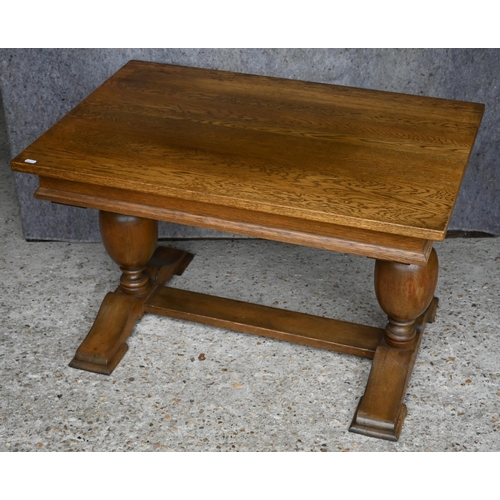 441 - #An old golden oak coffee table raised on baluster turned ends united by a centre stretcher, 88 x 56... 