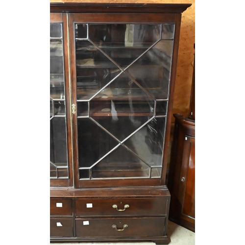 444 - An antique mahogany library cabinet with pair of astragal glazed doors enclosing adjustable shelves ... 