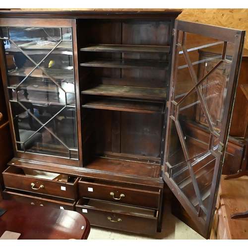 444 - An antique mahogany library cabinet with pair of astragal glazed doors enclosing adjustable shelves ... 