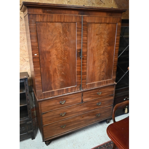 446 - Victorian mahogany linen press with fitted slides over two short and two long drawers, raised on tur... 