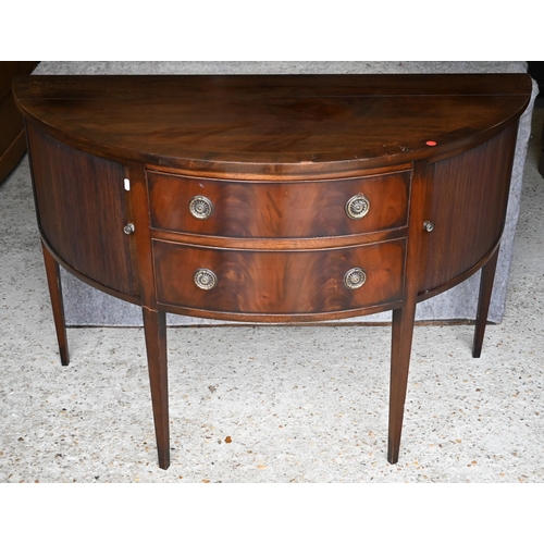 451 - #A Victorian mahogany demi-lune sideboard centred by two drawers flanked by tambour cabinet doors, o... 