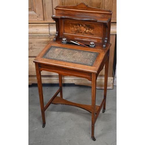 463 - A Victorian Bonheur-du-jour with mahogany inlay and floral marquetry panel and gallery, on wheels, 1... 