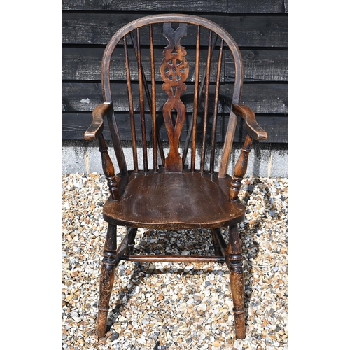 465 - A beech and elm wheelback Windsor chair