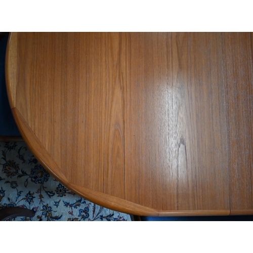 466 - A mid century Danish teak dining table with two leaves, 226 cm long x 94 cm wide x 70 cm high to/w e... 