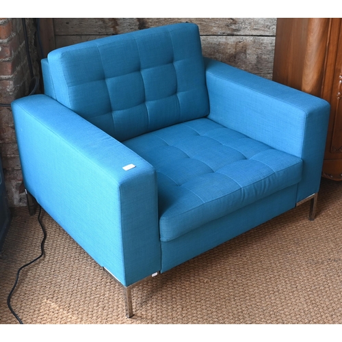 467 - A contemporary teal blue button upholstered chrome framed armchair