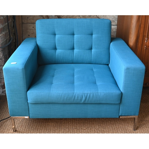 467 - A contemporary teal blue button upholstered chrome framed armchair