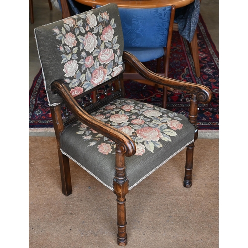 468 - A Continental stained beech open armchair with scroll arms and floral embroidered back and seat