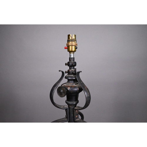 469 - A wrought iron telescopic standard lamp in the Art Nouveau style, 143 cm high