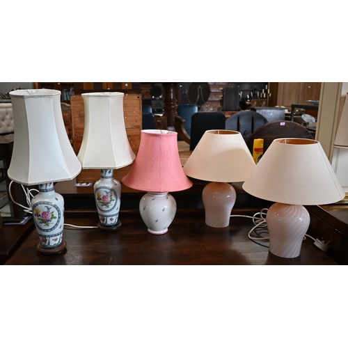 480 - Two pairs of table lamps, a pair of floral Dresden style ceramics lamps, one plain pink spiral glass... 