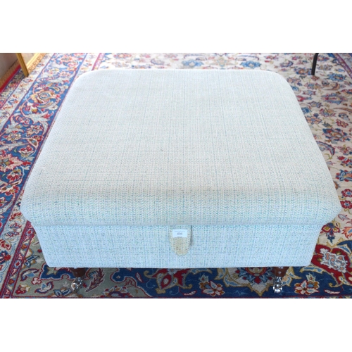 484 - A modern upholstered square centre stool/storage unit on chrome castors, 82 cm x 82 cm x 44 cm h