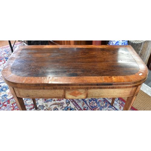 488 - A 19th century rosewood and satin banded card table with folding scarlet felt lined top raised on sq... 