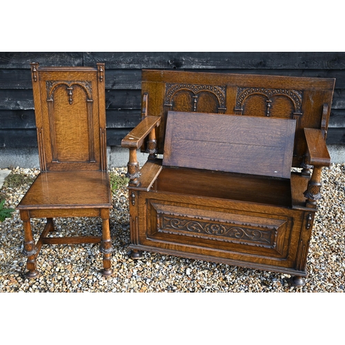 495 - A good quality carved oak monk's bench with carved supports, 107 cm wide, to/w a matching hallchair ... 