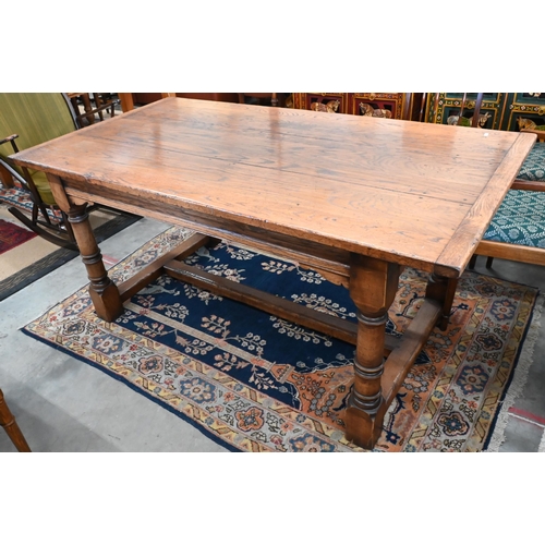 503 - A reproduction oak refectory dining table, three-plank cleated top, one end with sliding supports fo... 