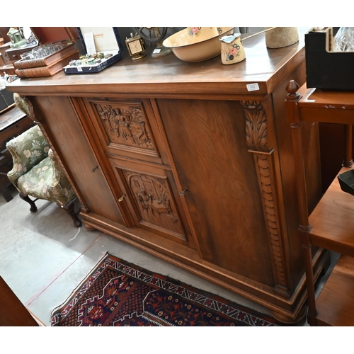 513 - Contemporary heavy quality Flemish oak side cabinet with central carved panel doors flanked by long ... 