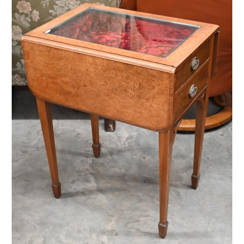 517 - Walnut and burr vitrine table with lower drawer and two drop leaves, on square tapering supports wit... 