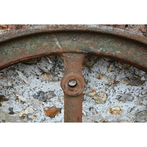 53 - A vintage cast iron spiked wheel, 91 cm dia.