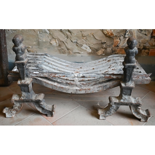 72 - An old cast iron fire grate to/w a pair of dogs, approx. 63 cm w x 31 cm d (3)