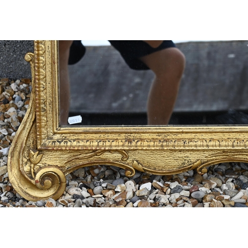 243 - A large modern wall mirror in decorative gilt frame, 125 cm x 115 cm