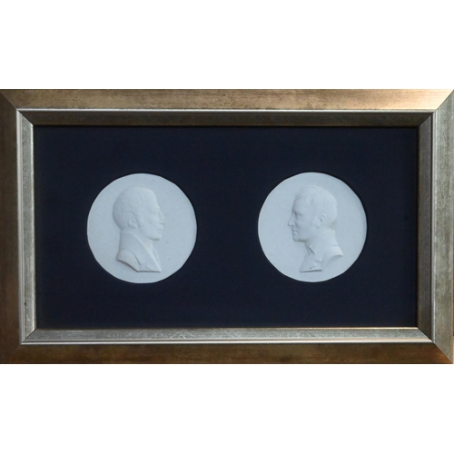 64 - A framed pair of Berlin porcelain medallions commemorating Wilhelm & Alexander von Humboldt; eac... 