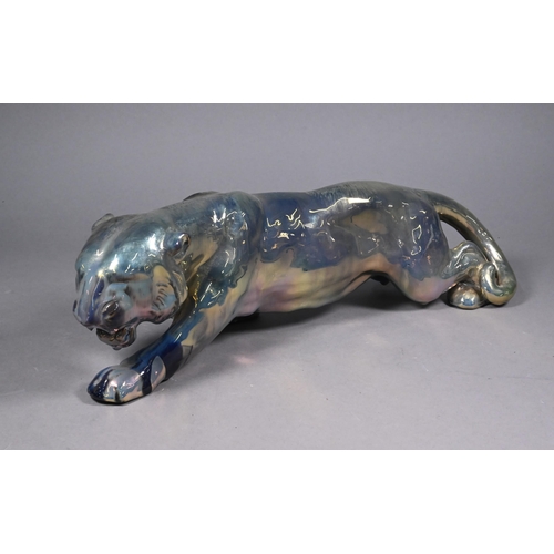 72 - A French Gres-Flammes Vosges Rambervillers earthenware stalking tiger with silver-resin lustre glaze... 