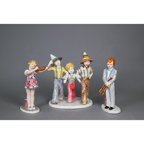 75 - A Goldscheider with Myott Son & Co. pottery group of three boys striding, 23 cm high, to/w two o... 