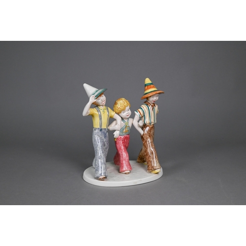 75 - A Goldscheider with Myott Son & Co. pottery group of three boys striding, 23 cm high, to/w two o... 