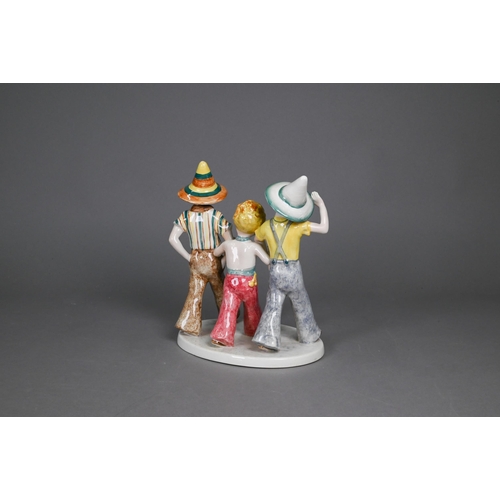 75 - A Goldscheider with Myott Son & Co. pottery group of three boys striding, 23 cm high, to/w two o... 