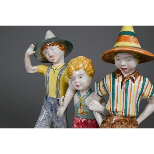 75 - A Goldscheider with Myott Son & Co. pottery group of three boys striding, 23 cm high, to/w two o... 