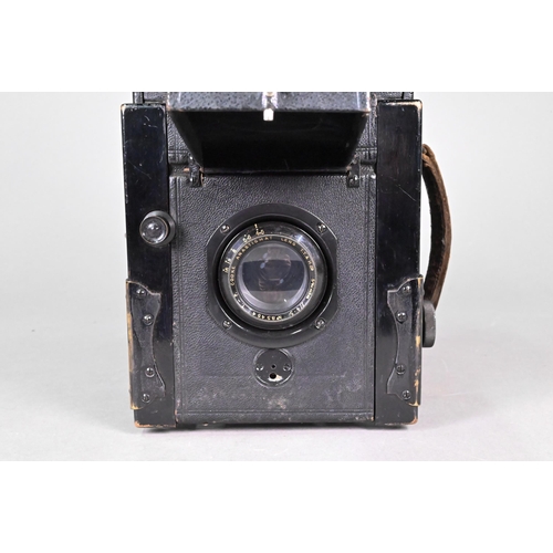 194 - A Thornton Pickard Special Ruby Reflex camera with P Cooke Astigmatic lens and black bellows, in lea... 