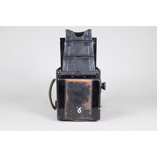 194 - A Thornton Pickard Special Ruby Reflex camera with P Cooke Astigmatic lens and black bellows, in lea... 