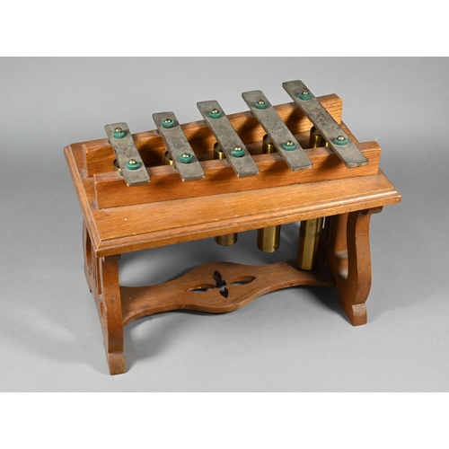 182 - An Edwardian oak-framed xylophone dinner-gong with five brass keys above tubular bells, on lyre supp... 