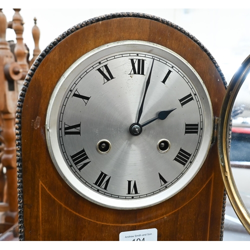 104 - Strung mahogany German mantel clock, striking on a coiled cong, 29 cm high