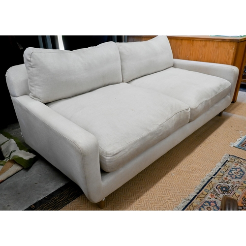 134 - A Loaf Banoffee sofa, cream woven linen upholstery and turned light oak tapering legs, 210 cm w x 10... 