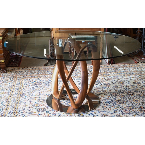 137 - An Italian Porada Infinity dining table with circular glass top on an American walnut Mobius loop st... 