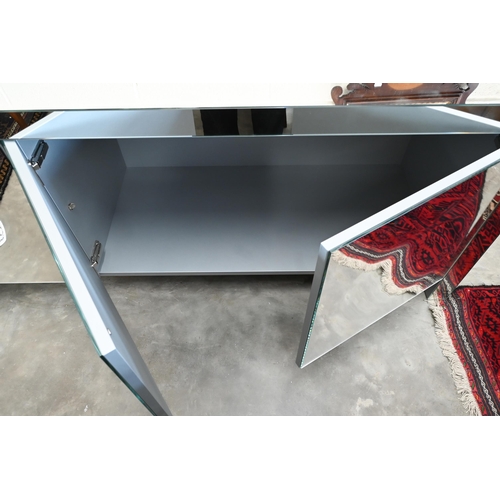 138 - An Italian Porada Empire mirrored sideboard designed by Gino Carrollo with four concave push-to-open... 