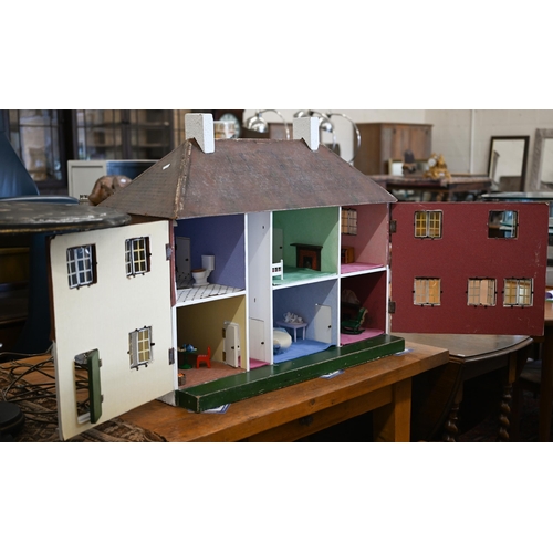 149 - A large Tri-Ang country house doll's house, front opening with fitted interior, c/w various furnitur... 